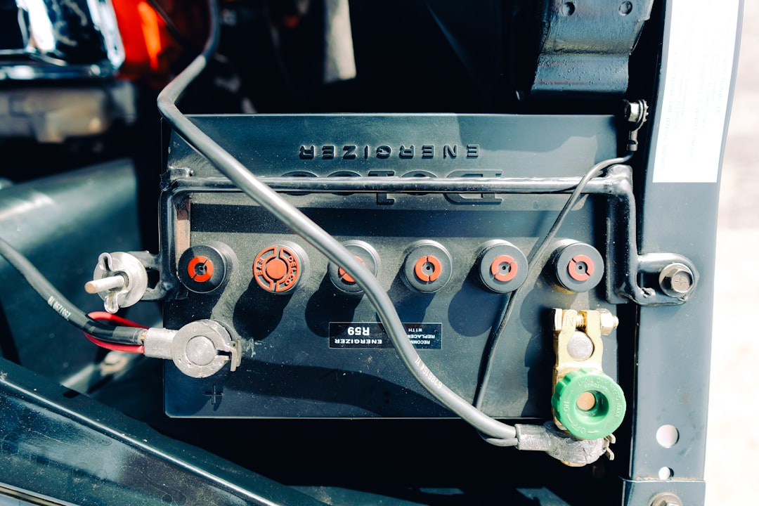 A close-up of a boat battery with tools and maintenance supplies, showcasing the importance of battery care for boating.