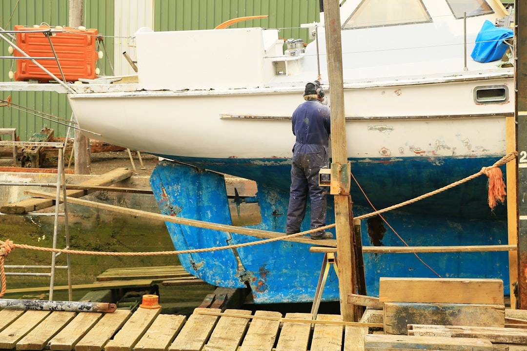 A boat covered with a protective cover on a calm lake, showcasing the importance of boat cover care.