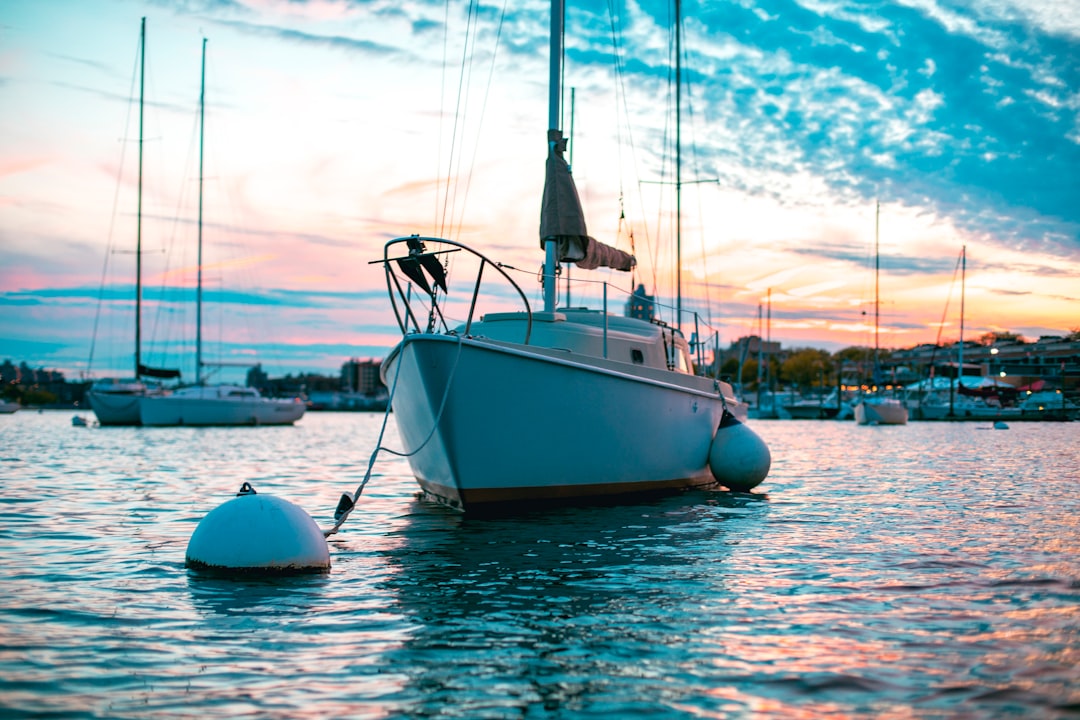 A well-maintained boat docked at a marina with tools and maintenance supplies nearby.