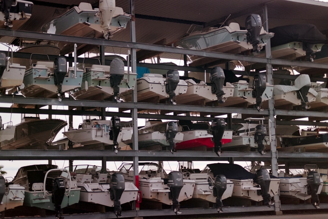 A variety of boats stored in different environments, including indoor, outdoor, and covered storage areas.