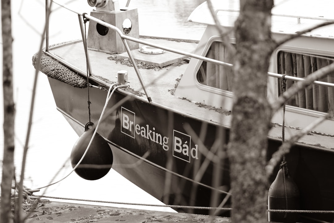 A serene view of a boat on calm waters, highlighting the joy of boating while subtly indicating the importance of safety and awareness.