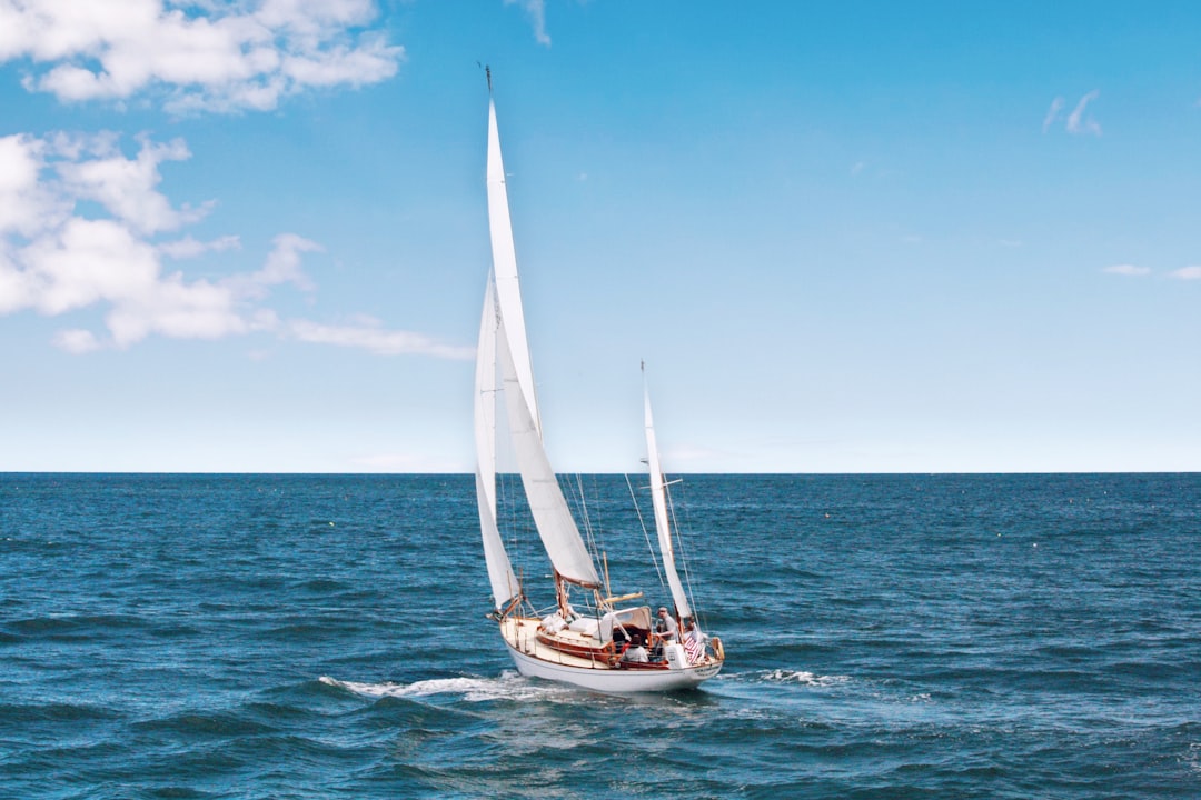A serene image of a small boat on calm waters, with a person examining it, symbolizing the journey of a first-time boat buyer.