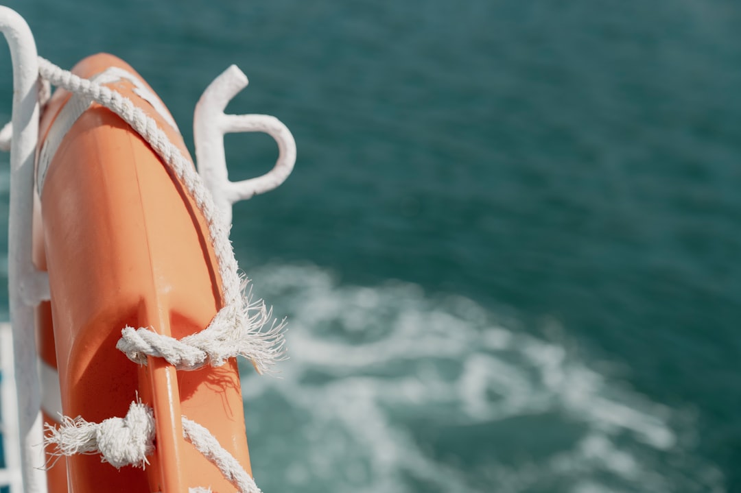A well-organized boat deck with essential gear for a safe and comfortable trip, including life jackets, coolers, and fishing equipment.